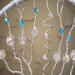 branches strung with clear glass beads and blue beaded accents